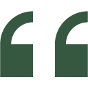 Green quotation marks on black background