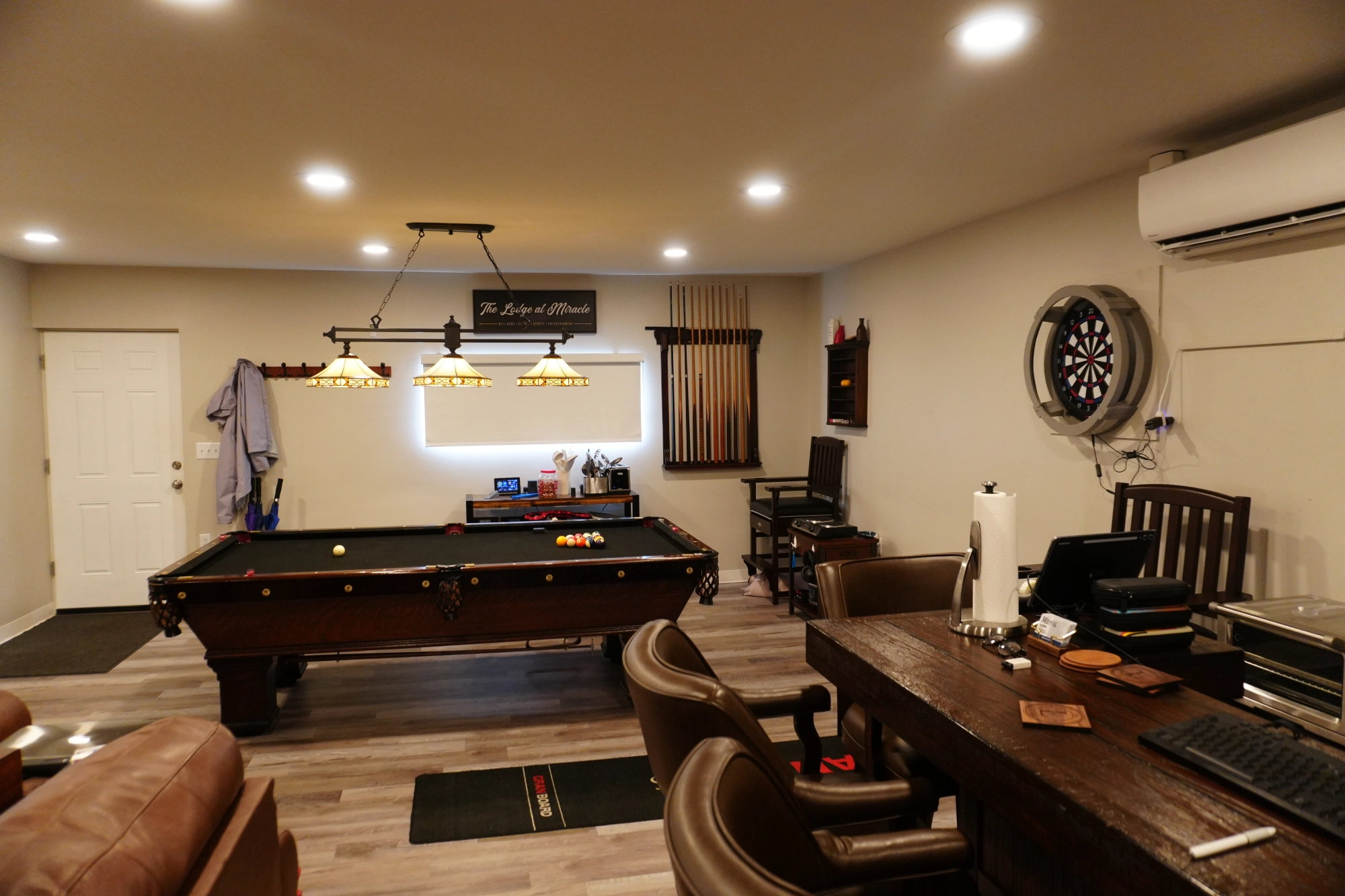 Basement game room with pool table and darts