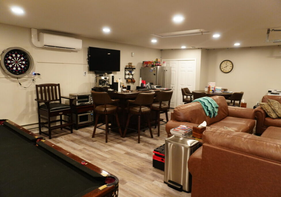 Basement recreation room with pool table, bar